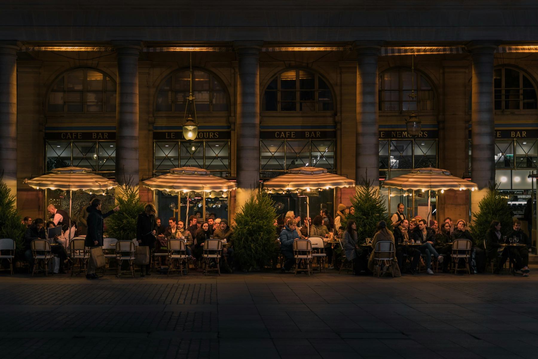 Restaurant and retail frontage with exterior lighting at night