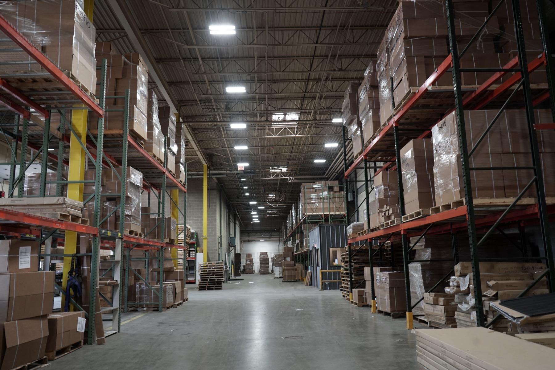 Warehouse distribution interior with high-bay lighting and pallet racks
